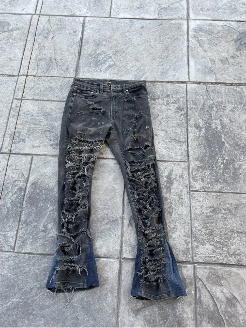Distressed Black Flare Jeans with Dark Hem